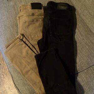 Two pairs boys H+M Skinny jeans. Black and camel colored
